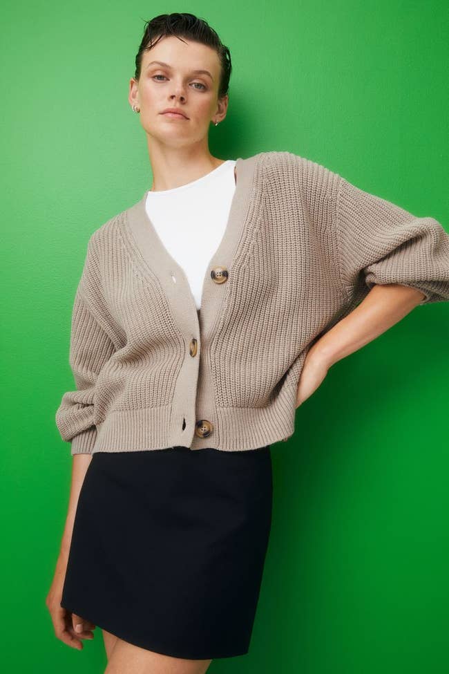 model wearing the brown button-down cardigan