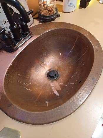 before photo of a reviewer's stained copper sink