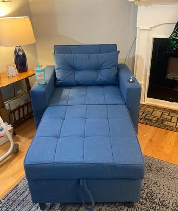 Blue 3-in-1 reading chair in the corner of a living room