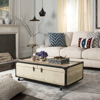 cream colored rollable coffee table