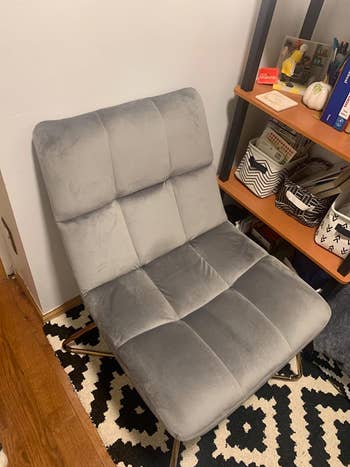 reviewer's gray velvet chair 