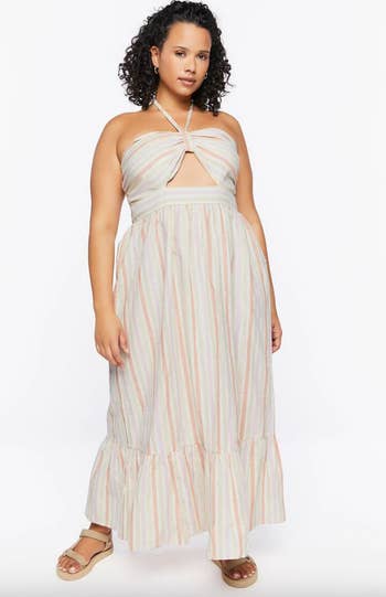model wearing the dress in the pink stripe pattern