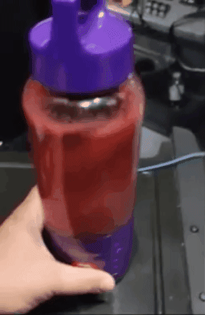 gif of reviewer blending smoothie in purple blender