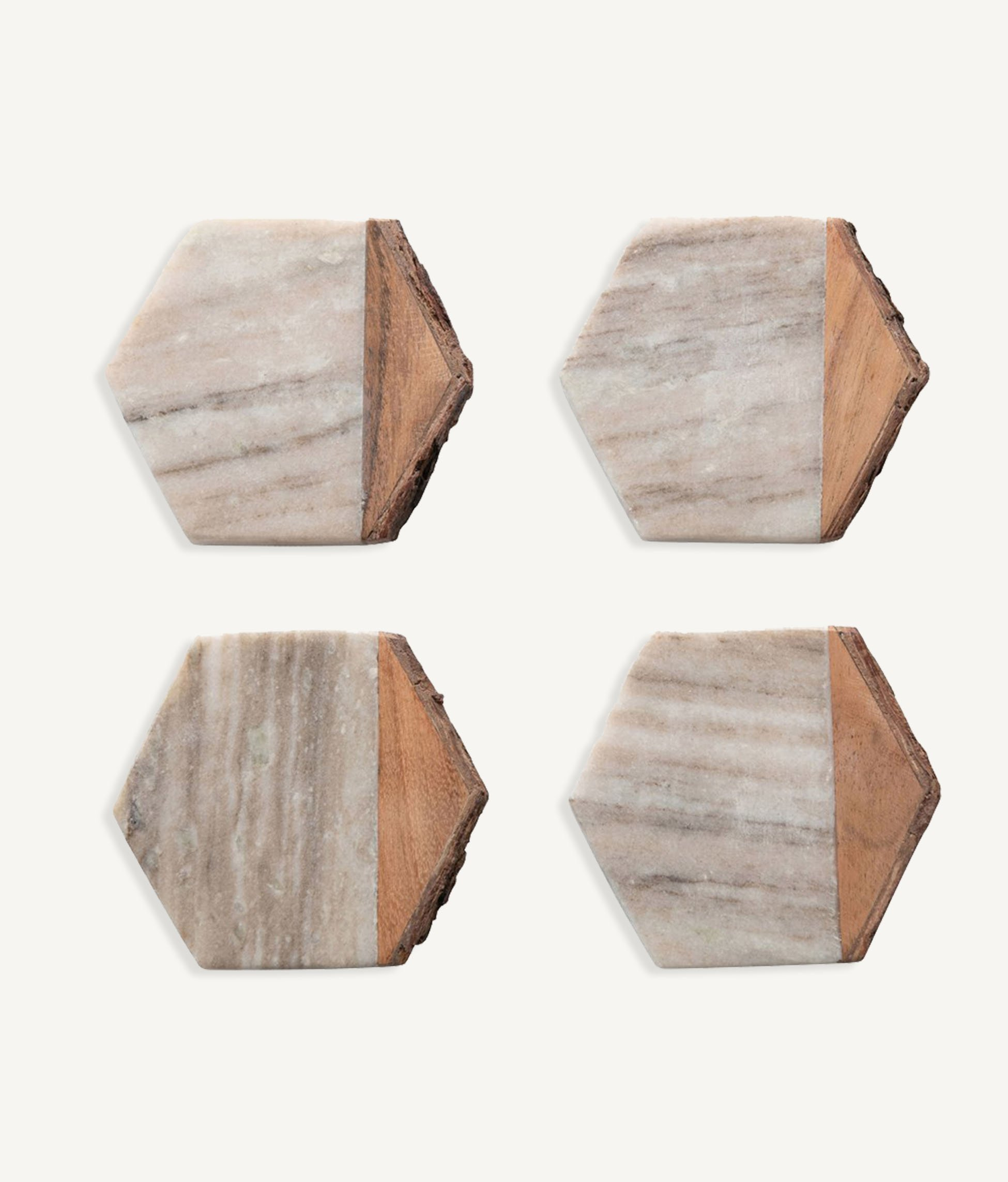 four hexagonal marble and wood coasters
