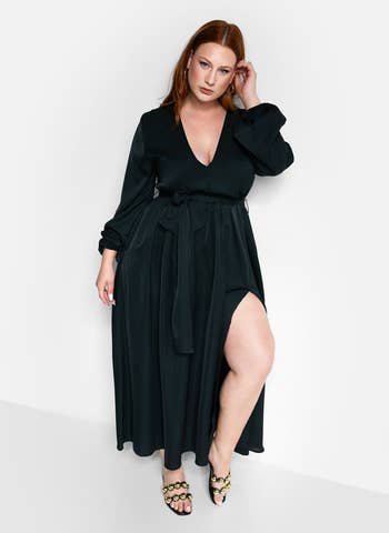 a model wearing the dress in black 