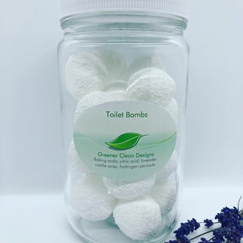 Glass jar of the white round toilet bombs