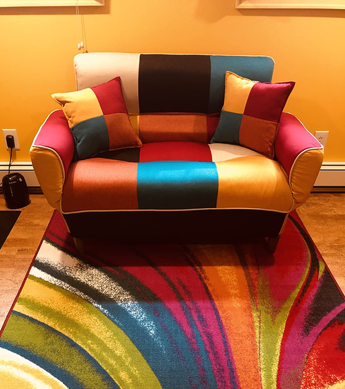 the loveseat that looks like a giant armchair in colorful patchwork