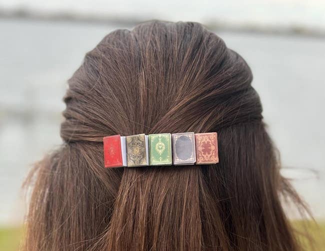 Hairpin styled arsenic  vintage books holds hairsbreadth  successful  a half-updo, outdoor inheritance  blurred