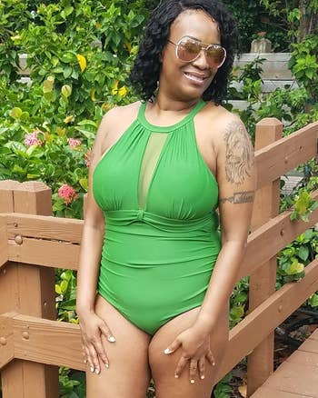 reviewer wearing the green bathing suit