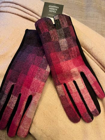 a reviewer photos of the gloves in pink, red, and purple 