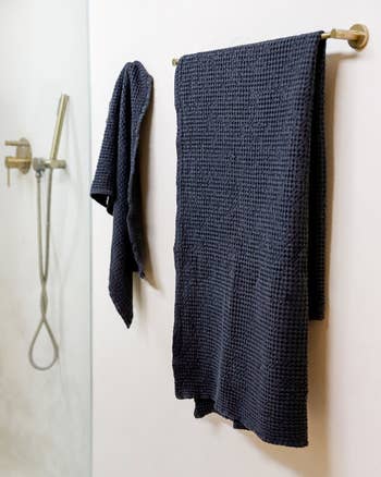 the towels hanging on a bathroom wall