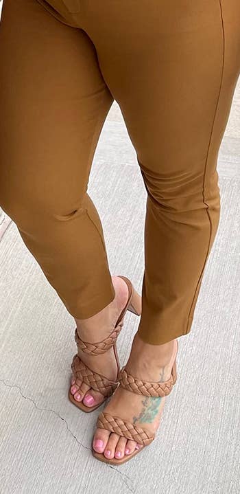 reviewer wearing the tan sandals