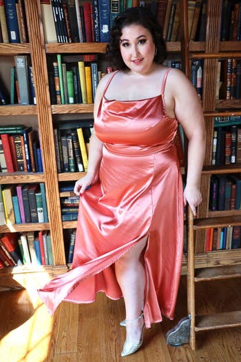 model in the long rose gold satin dress
