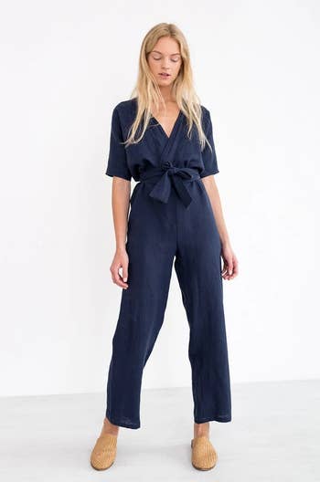 front of model wearing the navy jumpsuit