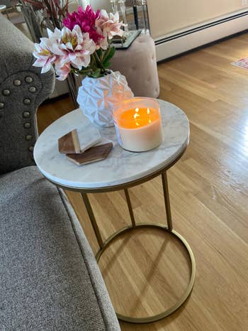 Reviewer image of the table with a candle and flowers on it