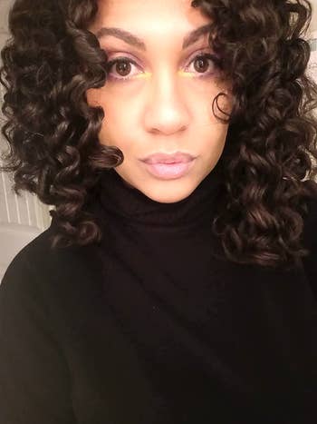 reviewer with curly hair after using the rods