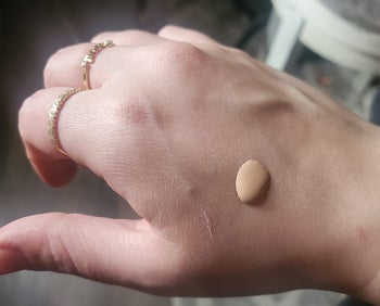 reviewer photo of the serum foundation on back of hand