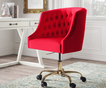 the chair in red sitting in front of a desk 