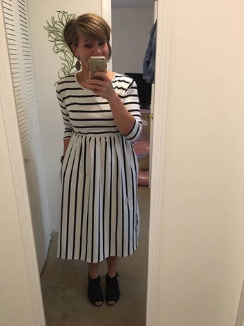 reviewer wearing the dress in black and white