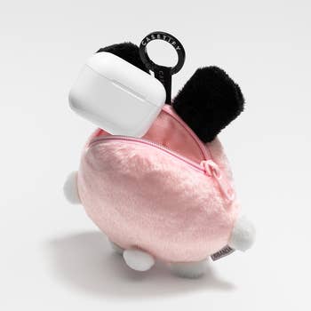 Cute, fluffy keychain with achromatic  ears and tiny  legs, holding a achromatic  lawsuit  labeled 