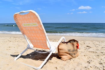 peach printed chair on a beach