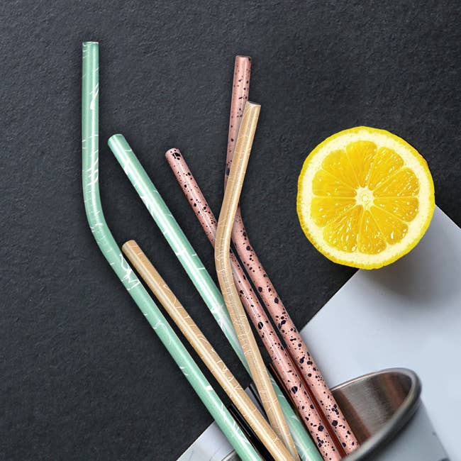 green gold and pink patterned metallic straws