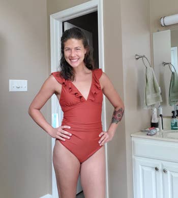 reviewer wearing red swimsuit