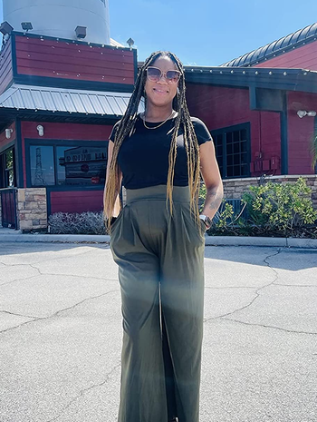 reviewer wearing the green pants