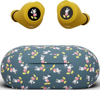 a earbud case with mickey all over it and gold ear buds with mickey on each one