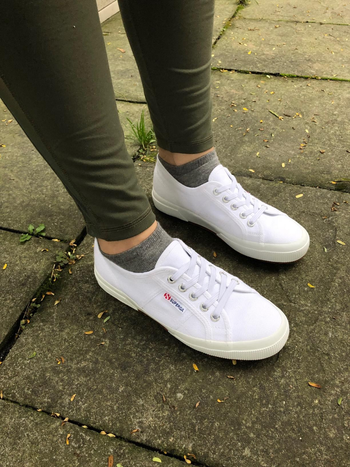 Reviewer is wearing the white tennis shoes