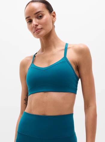 A idiosyncratic models a sleek, minimalist sports bra and leggings set, perfect for activewear shopping