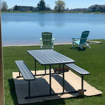 reviewer photo of outdoor picnic table with chairs by the lake