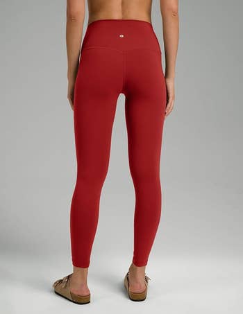 Back presumption    of a idiosyncratic   wearing high-waisted reddish  diversion  leggings