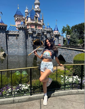 a reviewer wearing a disney-inspired tee that she had cropped herself