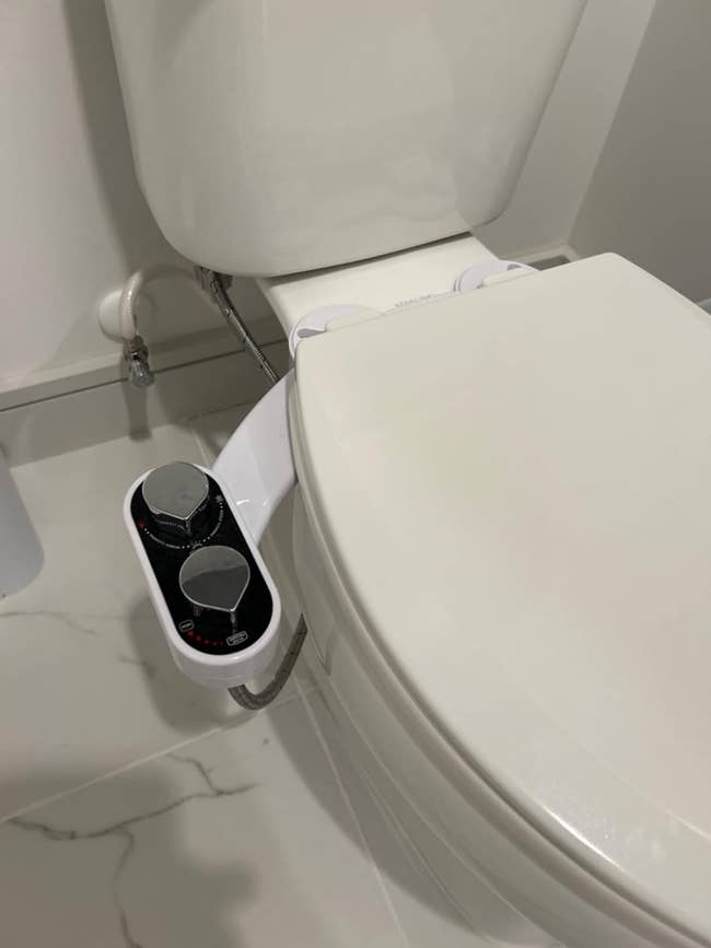 Electronic bidet attachment on a toilet
