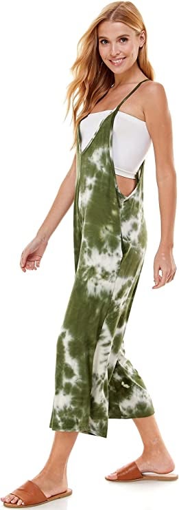 model wearing the green tie-dye version over a white bandeau top