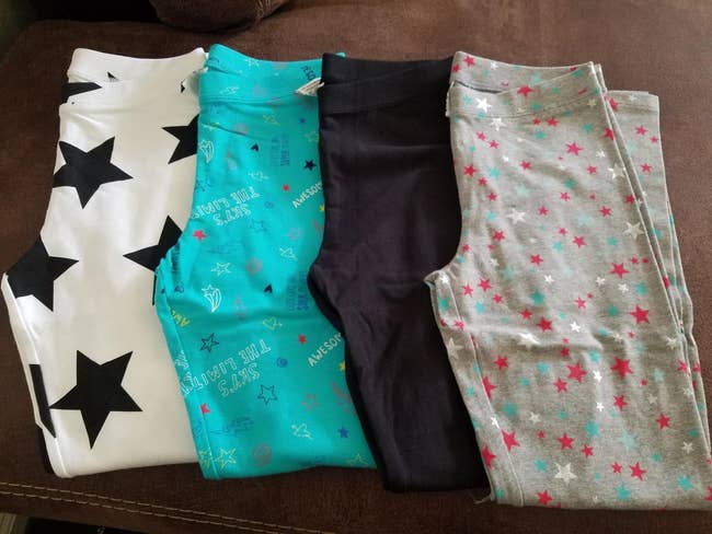 four pairs of leggings with different star designs on them