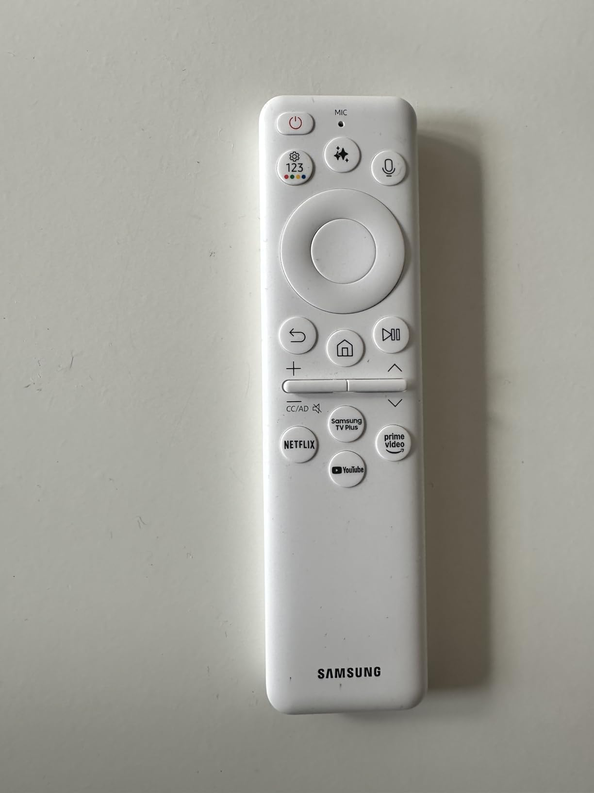 Remote power  with buttons for power, volume, home, Netflix, YouTube, and Prime Video