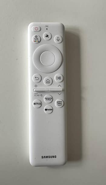 Remote power with buttons for power, volume, home, Netflix, YouTube, and Prime Video