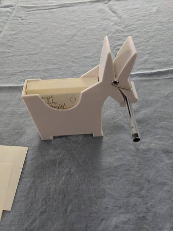 reviewer image of the white donkey memo holder with a pen in its mouth