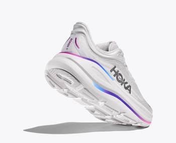 Hoka moving  footwear  with cushioned sole and sleek design, angled from down  showcasing marque  logo and benignant   features
