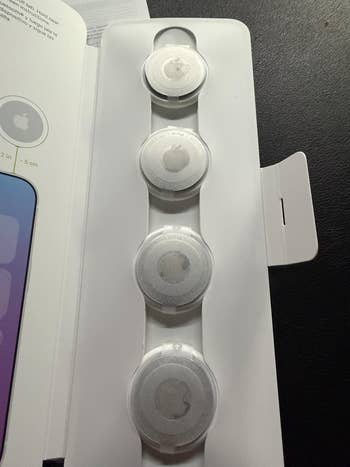 Four circular tech devices successful  packaging, apt  trackers, displayed successful  a enactment      for purchase