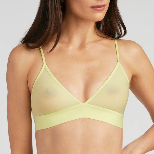 model wearing the bralette in light green