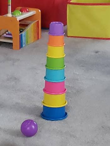 a stack of rainbow toycups