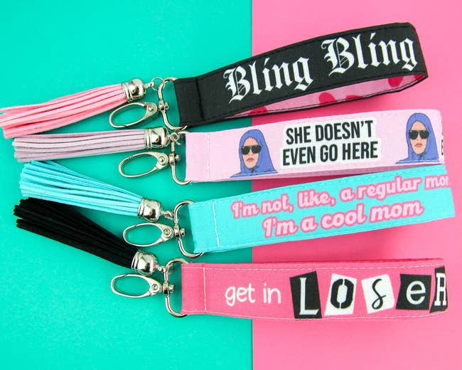 four keychain wristlets with Mean Girls quotes on them