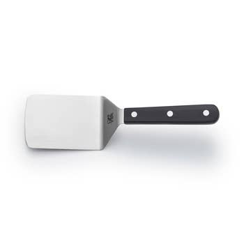 Metal spatula with a flat, wide   leaf  and a achromatic  grip  featuring 3  rivets, perfect  for flipping and serving food