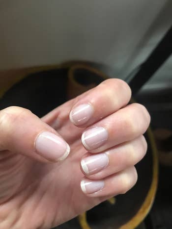 reviewer showing natural nails