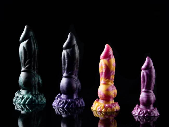 Assorted sizes of dragon dildos in multiple colors