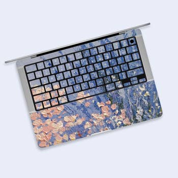 Laptop with a floral and brushstroke plan  keyboard screen  and touchpad