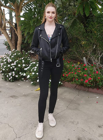 reviewer wearing the black jacket with black pants